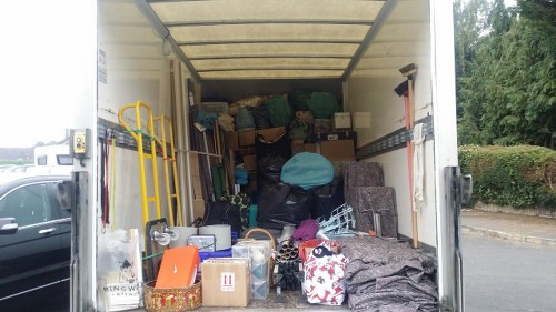 Man and Van service team assisting with moving boxes in Seven Sisters