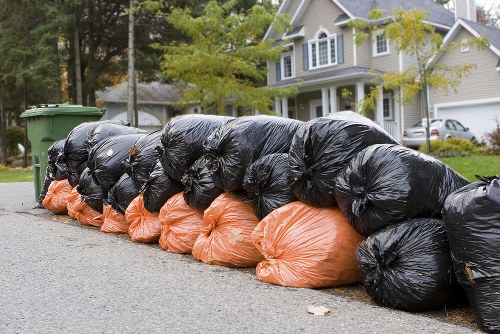 Workers managing construction debris efficiently